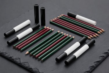 Soft-lit render of score pencils and dry-wipe markers on slate